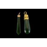 A Polished Jadeite Pendant with gold mount unmarked. Tests 18 ct. Length 52 mm.