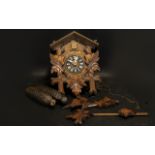 Wooden German Cuckoo Clock of traditional form,