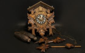 Wooden German Cuckoo Clock of traditional form,