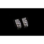 Tanzanite J-Hoop Style Earrings, round cut tanzanites set in openwork, curved edge,