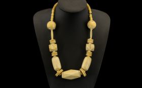 An African Bone Necklace of Unusual form, measuring 22 inches in length.