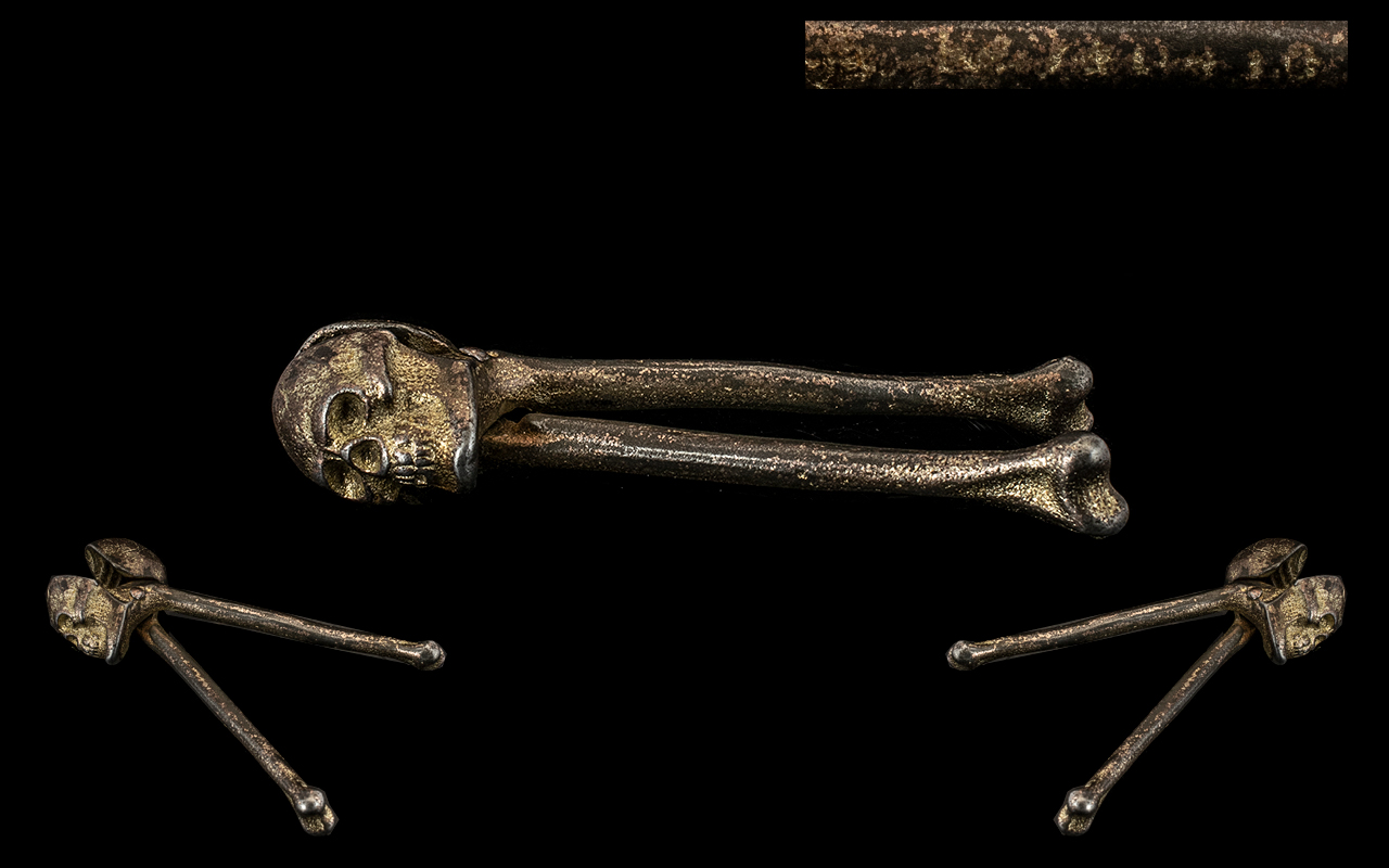 Skull & Crosssbones Cast Iron Nut Crackers with registration mark to the legbone. 6" in length.