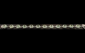 Green Amethyst Tennis Bracelet, 12 oval cut sparkling green amethysts, totalling 20cts,