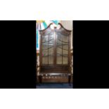 An Edwardian Mahogany Inlaid Display Cabinet - broken pediment above shaped astral glazed door.