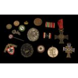 Mixed Lot Of German WW2 Badges To Include A German RAD Labour Corps Cap Badge, Two Wound Badges,