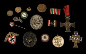 Mixed Lot Of German WW2 Badges To Include A German RAD Labour Corps Cap Badge, Two Wound Badges,