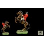 Beswick Horse & Rider Painted Figure. Red jacket Huntsman seated on rearing horse. Model No. 868.