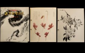 Japanese Art Book containing a large collection of Sepia and coloured prints by notable artists,