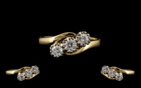 18ct Yellow and White Gold 3 Stone Diamond Set Ring of Excellent Design and Form.