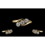 18ct Yellow and White Gold 3 Stone Diamond Set Ring of Excellent Design and Form.