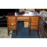 An Antique Mahogany Twin Pedestal Desk blood red leather tooled top,