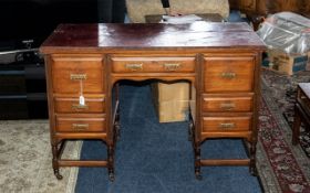 An Antique Mahogany Twin Pedestal Desk blood red leather tooled top,