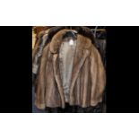 Blond Mink Jacket with collar and reveres, with hook and eye fastening and two side slit pockets.