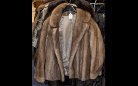 Blond Mink Jacket with collar and reveres, with hook and eye fastening and two side slit pockets.