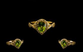 Peridot Pear Shaped Halo Ring, a pear cut, bright, clear peridot of 1.