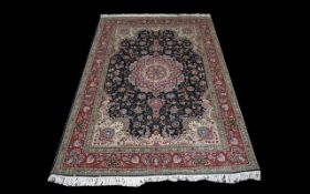 A Persian Isfahan Carpet of Extremely fine quality, close knotted weave, the central panel and