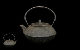 An Antique Japanese Cast Iron Tea Kettle