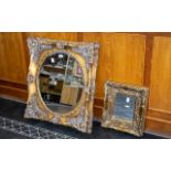 Two Ornate Gilt Framed Mirrors with deep frames, the larger measures approx.