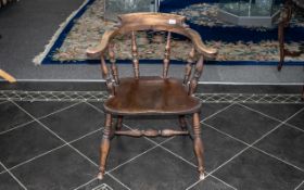 A Victorian Bar Room Captain's Style Chair with knuckle arms and spindle back, and turned legs,