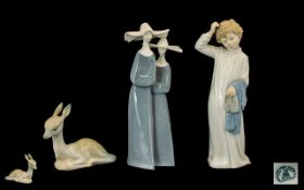Three Lladro Style Porcelain Figures comprising of a Saxe Nun Figure,