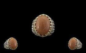 Peach Sunstone Solitaire Statement Ring, a 16ct oval cut cabochon of the sunstone, the soft peach