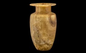 Antique Middle Eastern Calcite Jar with broad rimmed top, of typical shape.