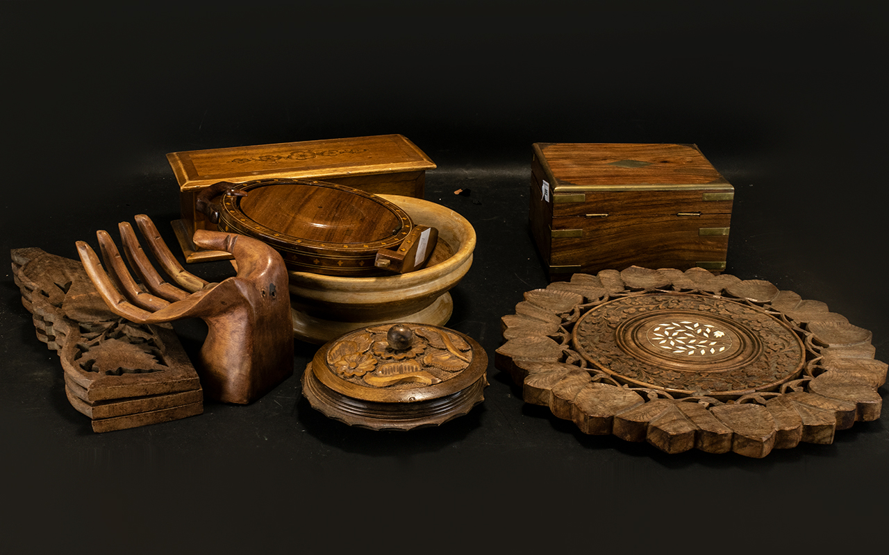 A Collection of Carved Wooden Items to include a carved hand, two bowls, an inlaid plate stand,