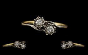 18ct Gold and Platinum Attractive Illusion Set Ring. The Two Round Brilliant Cut Diamonds, Clear and