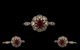 Edwardian Period 18 ct Gold - Attractive Ruby and Diamond Ring in a flowerhead setting.