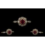 Edwardian Period 18 ct Gold - Attractive Ruby and Diamond Ring in a flowerhead setting.