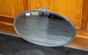 Chrome Art Deco Oval Shaped Mirror with a Ribbon Design to the Top Edge. c.1930's.