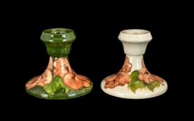 Pair of Small Moorcroft Candlesticks. Green and ivory glazed bodies with floral decorations. 3.