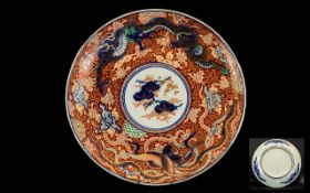 Imari Charger Meiji Period Finely Decorated with a Coiling Dragon Amongst Clouds In The Typical