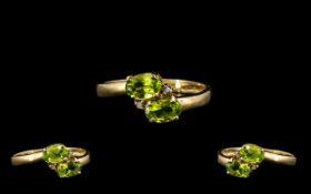 Ladies 9ct Gold Attractive Two Stone Peridot Set Dress Ring. Marked 9.375. Ring Size - O.