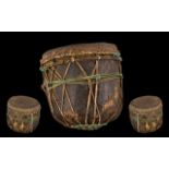 Tribal Antique Wood Drum hewn form a tree trunk with a skin applied. Decorated in string cords. 10