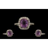 Contemporary 18ct White Gold Quality Amethyst & Diamond Set Dress Ring. Marked 18ct, the central