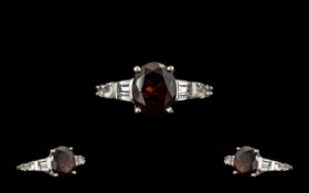 Red Garnet Solitaire Style Ring, a 4.