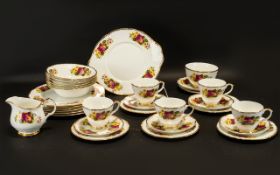 Part Teaset comprising 5 cups and 6 saucers and side plates, 6 soup/dessert bowls.