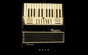 Vintage Piano Accordian by Maggi & Co. Black and white colour with tan shoulder strap.