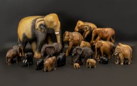 Eighteen Assorted Wooden Elephant Ornaments - Varying in quality and size from around 2" to 18" in