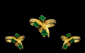 18ct Gold - Attractive 3 Stone Emerald Set Ring of Contemporary Design. The Columbian Emeralds of