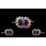 18ct Two Tone Gold Ruby Blue Sapphire and Diamond Set Dress Ring of pleasing design. The ruby and