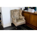 Queen Anne Style Upholstered Wing Arm Chair on carved cabriole legs,