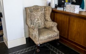 Queen Anne Style Upholstered Wing Arm Chair on carved cabriole legs,