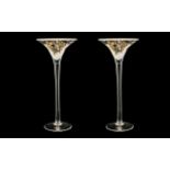 A Pair of Goebel Orchid Glass Candlesticks, 16 inches high.