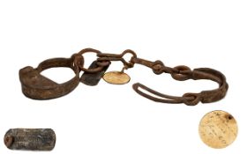 Slave Shackles. Early 19th century slave shackles with the original tag ( property of OAK GROVE )