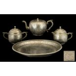 A Chinese Kuthing Swatow Pewter Tea Service, comprising teapot, two handled sugar bowl,