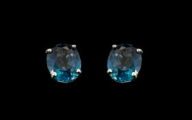 9ct White Gold Blue Topaz Earrings.