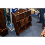 An Edwardian Mahogany Aesthetic Design Hanging Wall Cabinet with shelves and two centre cupboards.
