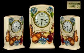 Moorcroft Clock in cream with bright floral decoration, stamped WM and Moorcroft to base of clock.